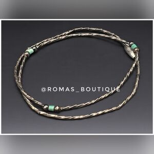 Vintage liquid silver necklace with turquoise beads.